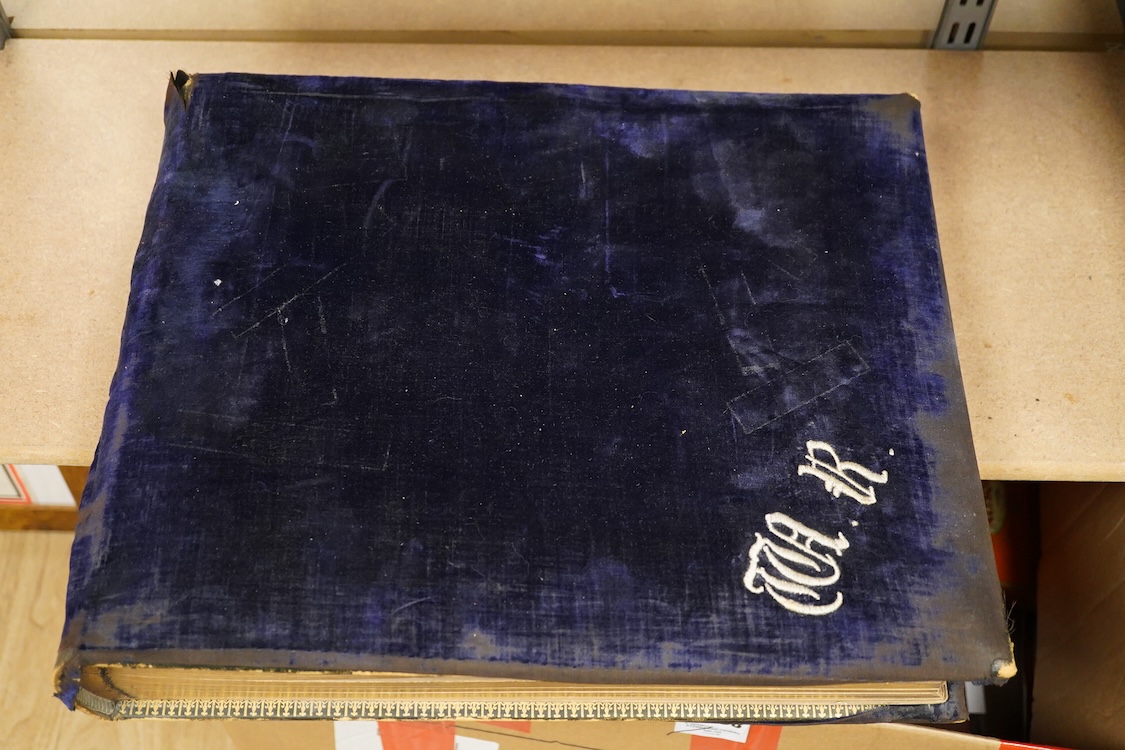 An Edwardian decorated photograph album relating to Oriel College, University of Oxford & Westminster School, with hand painted decorated titles for each mounted photograph, black-and-white photographs and bound in Oxfor